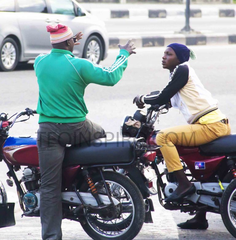 Taking-a-break.-As-they-await-another-rush-hour-these-motorcyclers-engage-in-what-seems-to-be-an-interesting-conversation